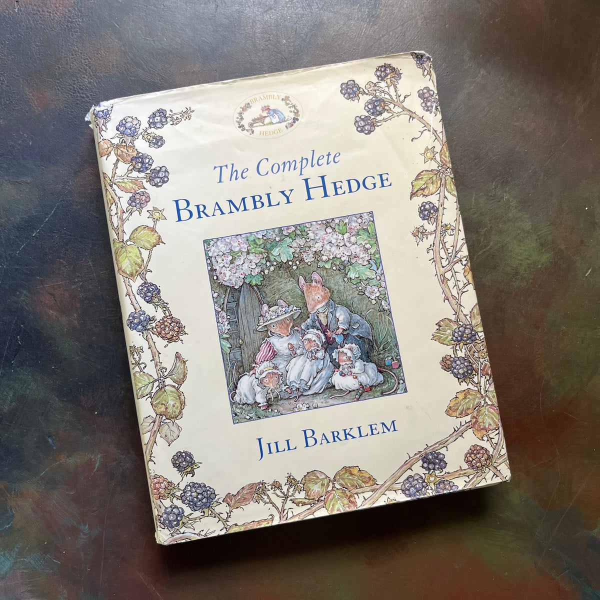 The Complete Brambly Hedge written and illustrated by Jill Barklem-vintage children's picture book-If You Love Beatrix Potter-view of the dust jacket's cover - note the worn condition around the edges