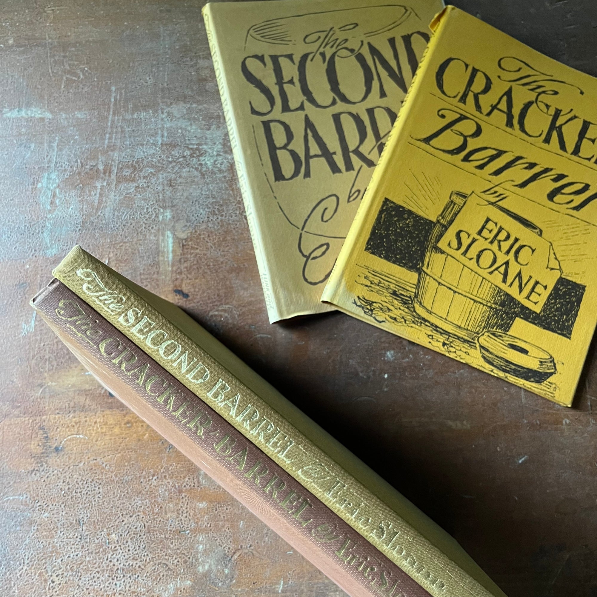 vintage American history Books, American Illustrator, Iconic American History - The Cracker Barrel and The Second Barrel written & Illustrated by Eric Sloane - view of the spines