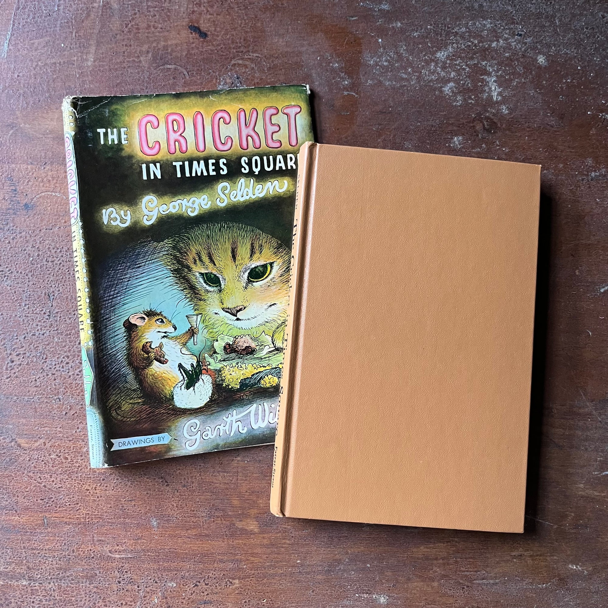 vintage children's chapter book, Newbery Honor Book - The Cricket of Times Square written by George Shelden with illustrations by Garth Williams - view of the front cover which is a plain tan color