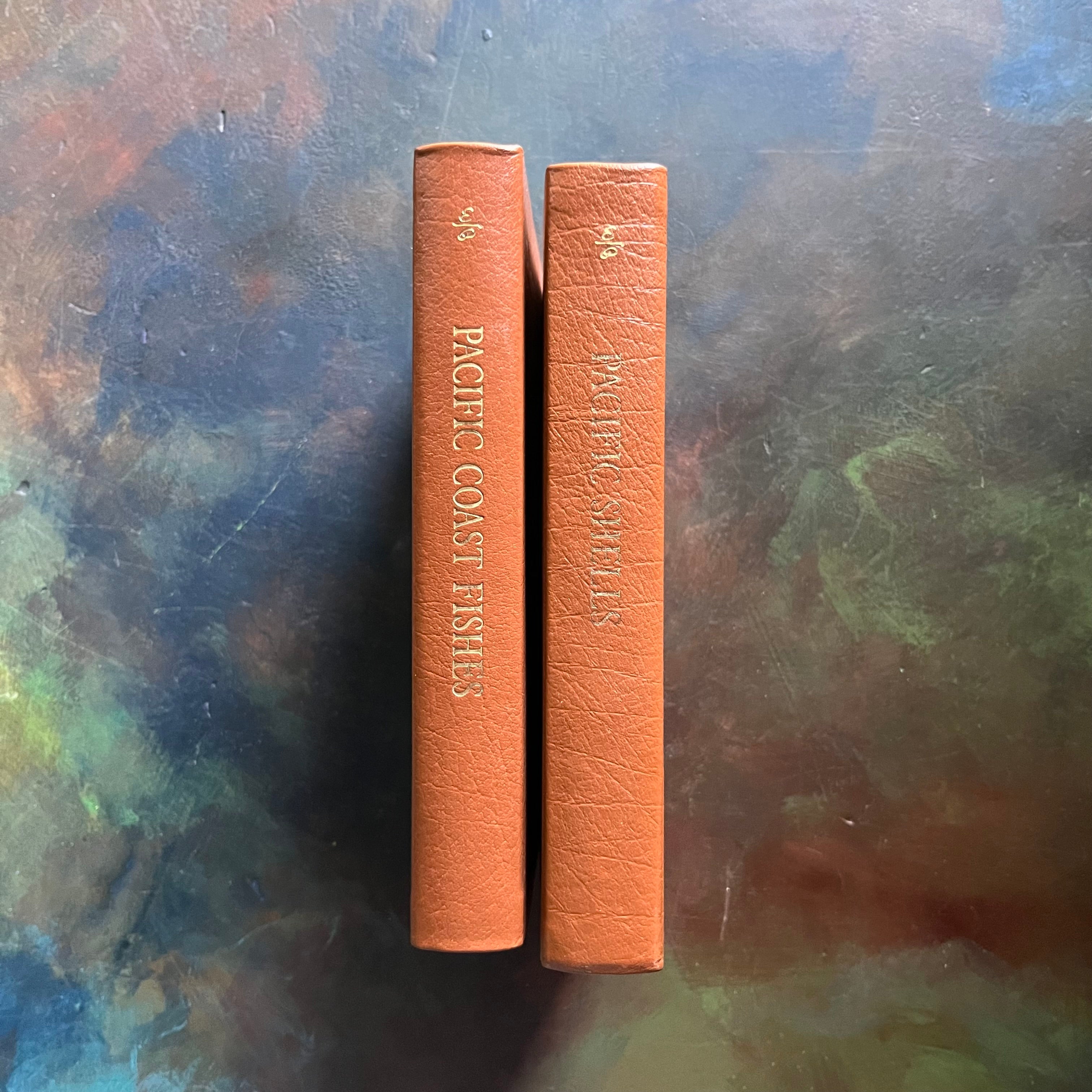 The Easton Press 50th Anniversary Leatherbound Editions-Peterson Field Guides-Pacific Coast Fishes and Pacific Shells-vintage nature books-view of the leatherbound spines with gold embossing