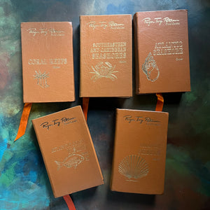 The Easton Press 50th Anniversary Leatherbound Editions-Peterson Field Guides-Set of Five-Atlantic Shores, Shells, Coral Reefs, & Fishes-view of the leatherbound covers with gold embossing