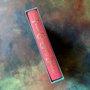 The Folio Christmas Book by The Folio Society of London-A Collection of Seasonal Stories and Poems-classic Christmas Stories & Poems-view of the spine with the title of the book in gold leaf