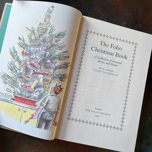 The Folio Christmas Book by The Folio Society of London-A Collection of Seasonal Stories and Poems-classic Christmas Stories & Poems-view of the title page & frontispiece depicting a giant pile of dishes that look like a Christmas tree