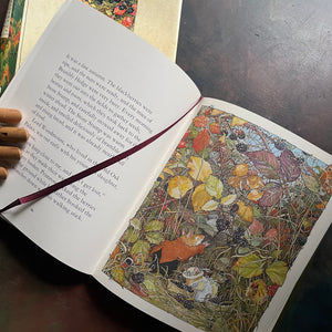 The Four Seasons of Brambley Hedge-written and illustrated by Jill Barklem-classic picture book anthology-read-aloud favorite-homeschool-favorite-view of the full-page color illustration and the ribbon page marker
