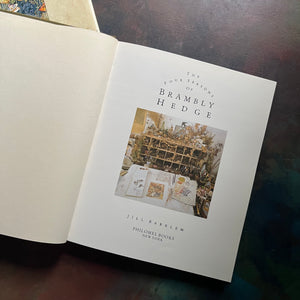 The Four Seasons of Brambley Hedge-written and illustrated by Jill Barklem-classic picture book anthology-read-aloud favorite-homeschool-favorite-view of the title page with photograph of a workspace with drawings & other collected finds to inspire the stories