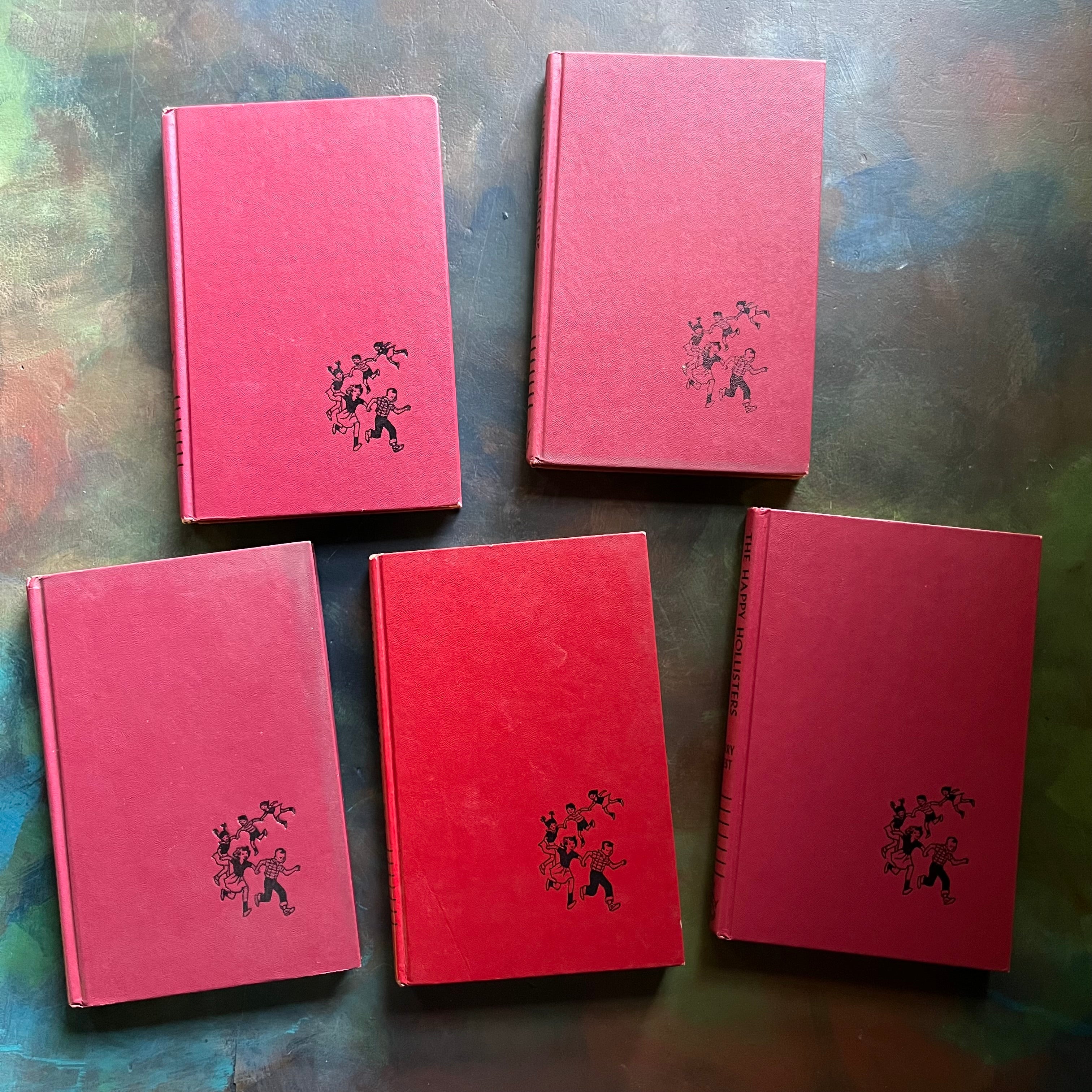 The Happy Hollisers Book Set written by Jerry West-vintage children's mystery books-Set of Five-view of the embossed front covers