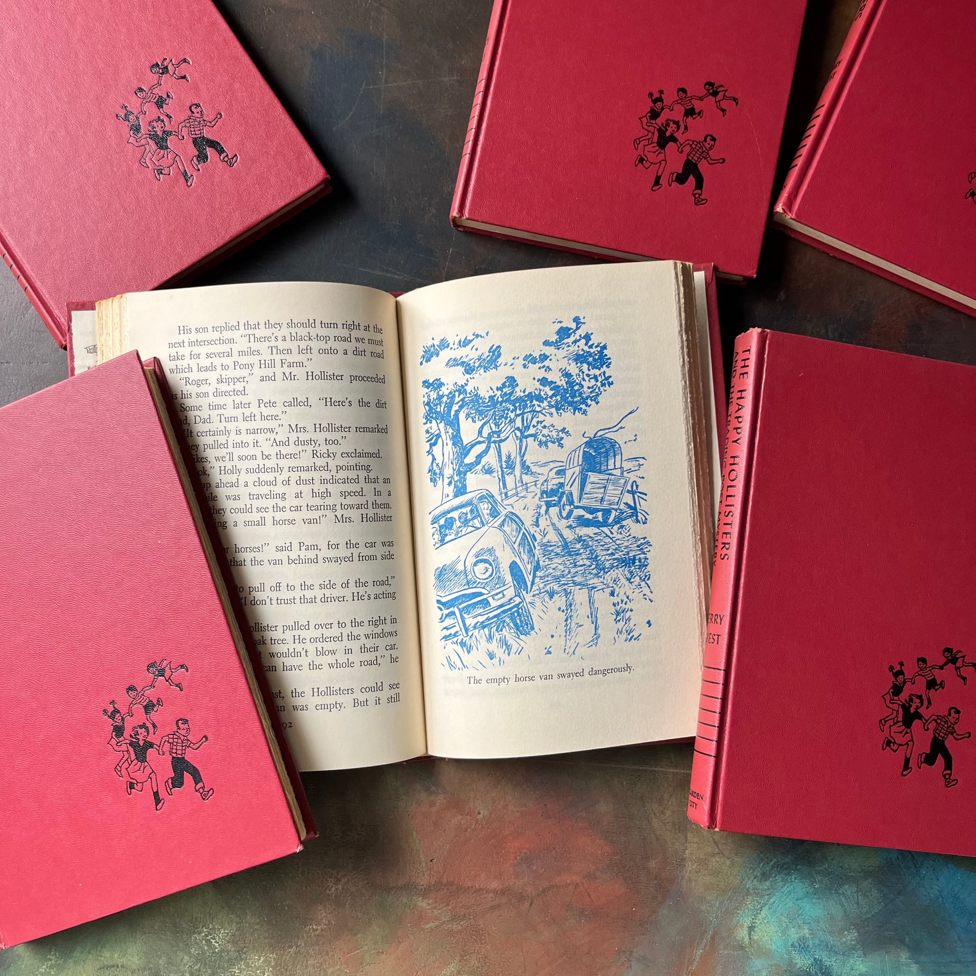 The Happy Hollisters Six Book Set-Jerry West-America's Favorite Classic Mystery Series for Young Readers-Helen Hamilton-vintage children's chapter books-view of the full-page illustrations in blue