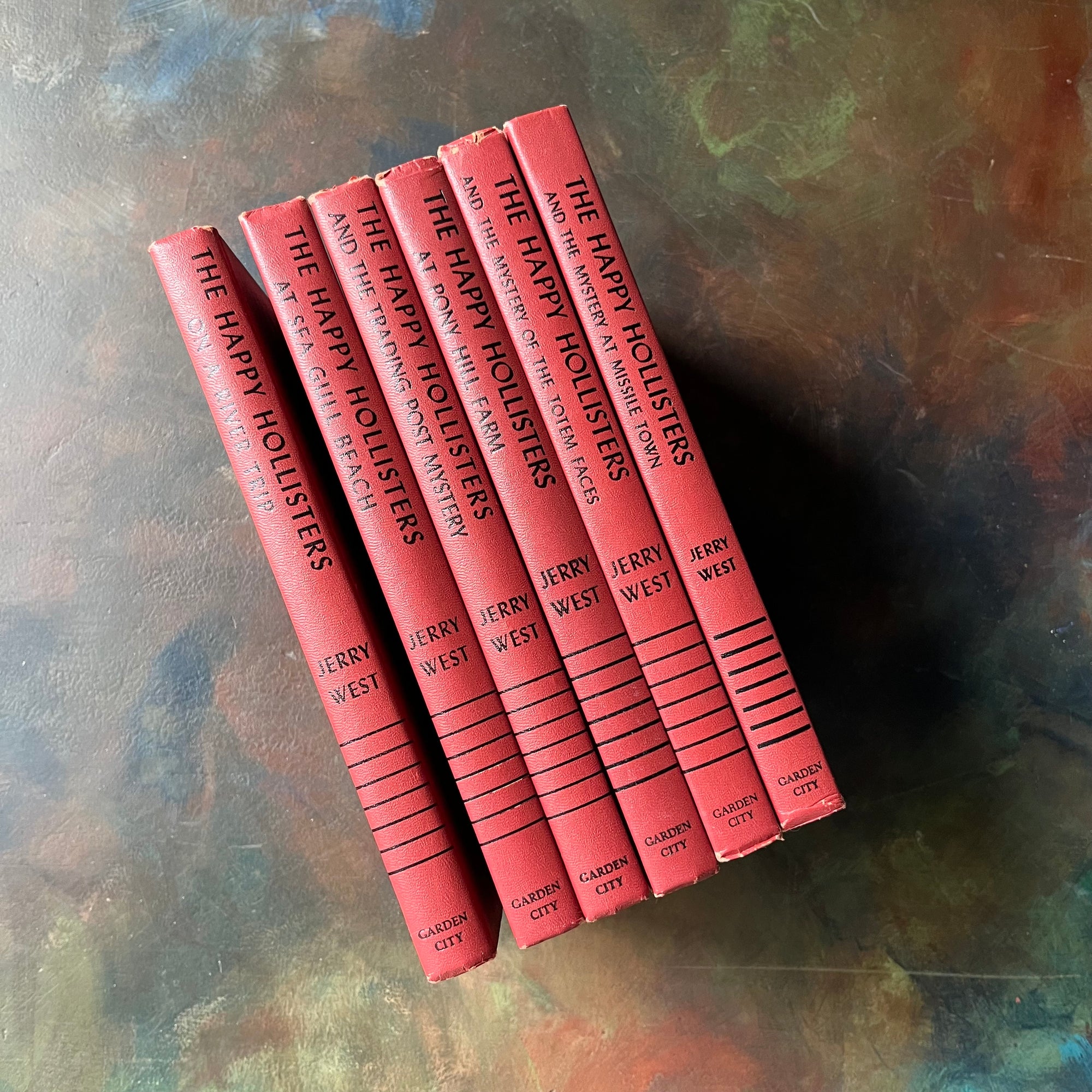 The Happy Hollisters Six Book Set-Jerry West-America's Favorite Classic Mystery Series for Young Readers-Helen Hamilton-vintage children's chapter books-view of the spines in red & black