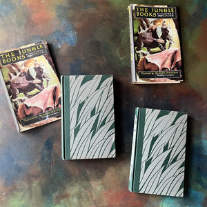 The Jungle Books by Rudyard Kipling Volumes I & II-Junior Illustrated Library Editions-vintage children's classics-view of the front covers in green & gray design with grass or leaves