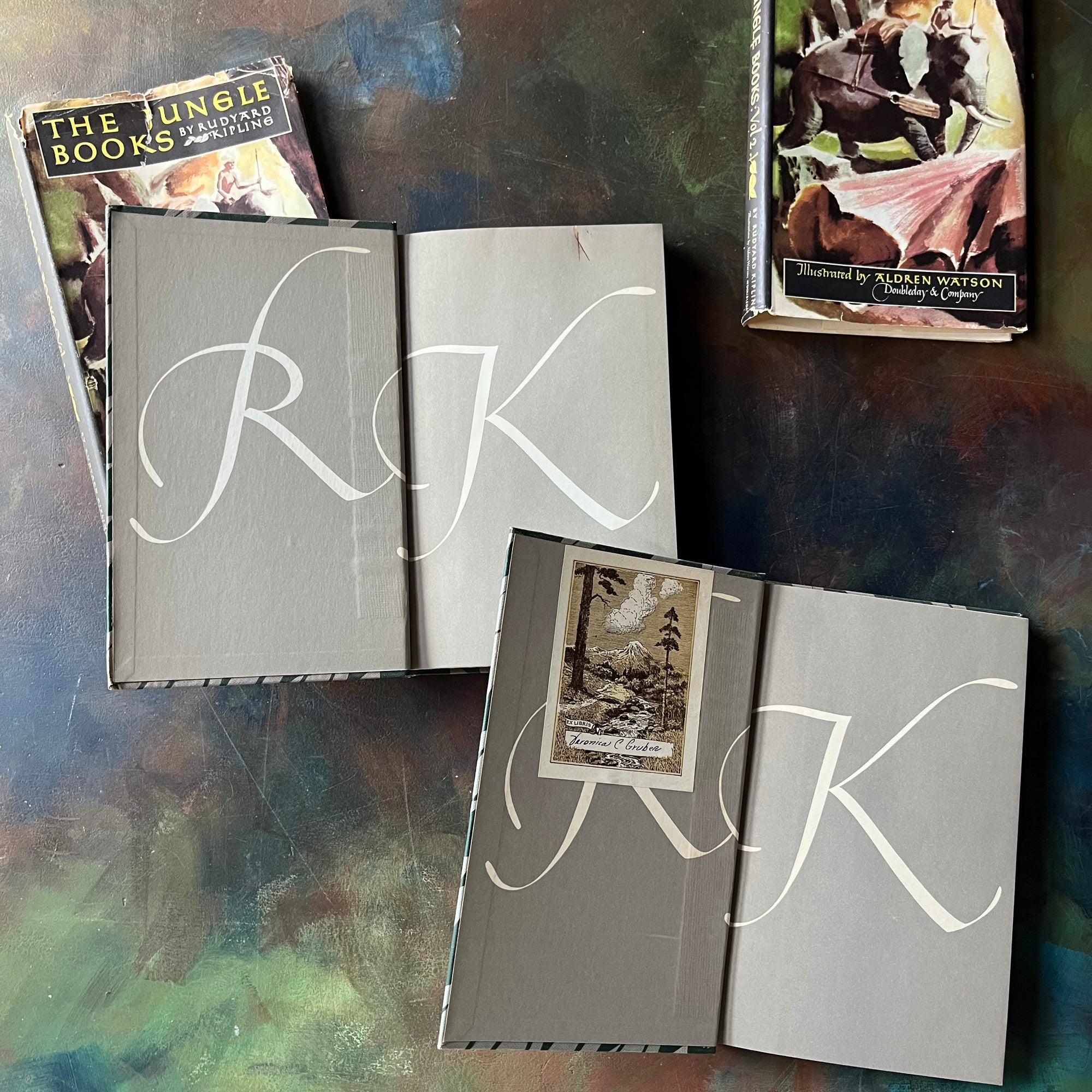 The Jungle Books by Rudyard Kipling Volumes I & II-Junior Illustrated Library Editions-vintage children's classics-view of the inside cover with "RK" on both sides - please note book II has a bookplate attached to the inside cover partially covering the R.
