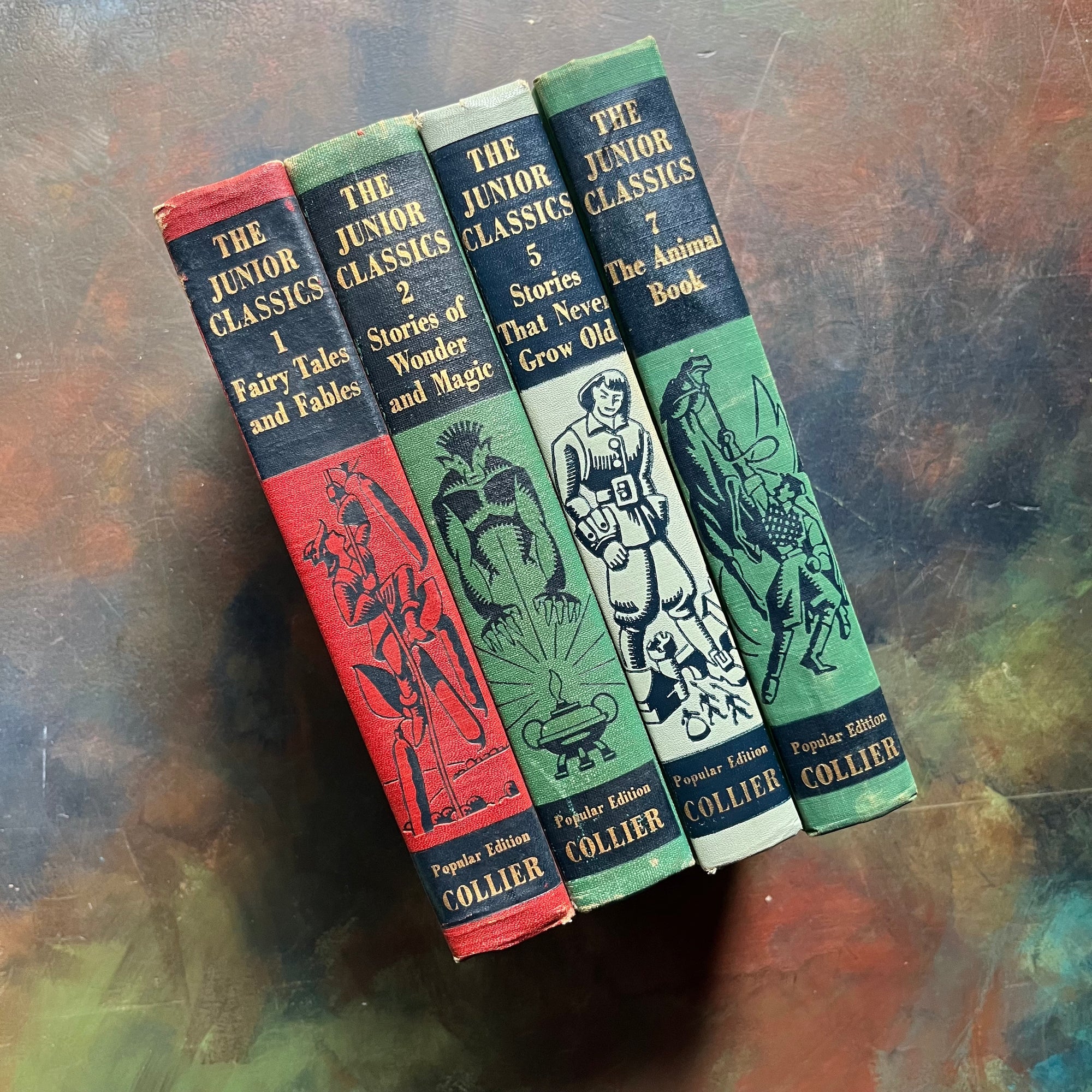 The Junior Classics Young Folks Shelf of Books-Volumes 1, 2, 5, 7-classic children's literature-anthology for children-short stories-view of the spines with images and the book titles present
