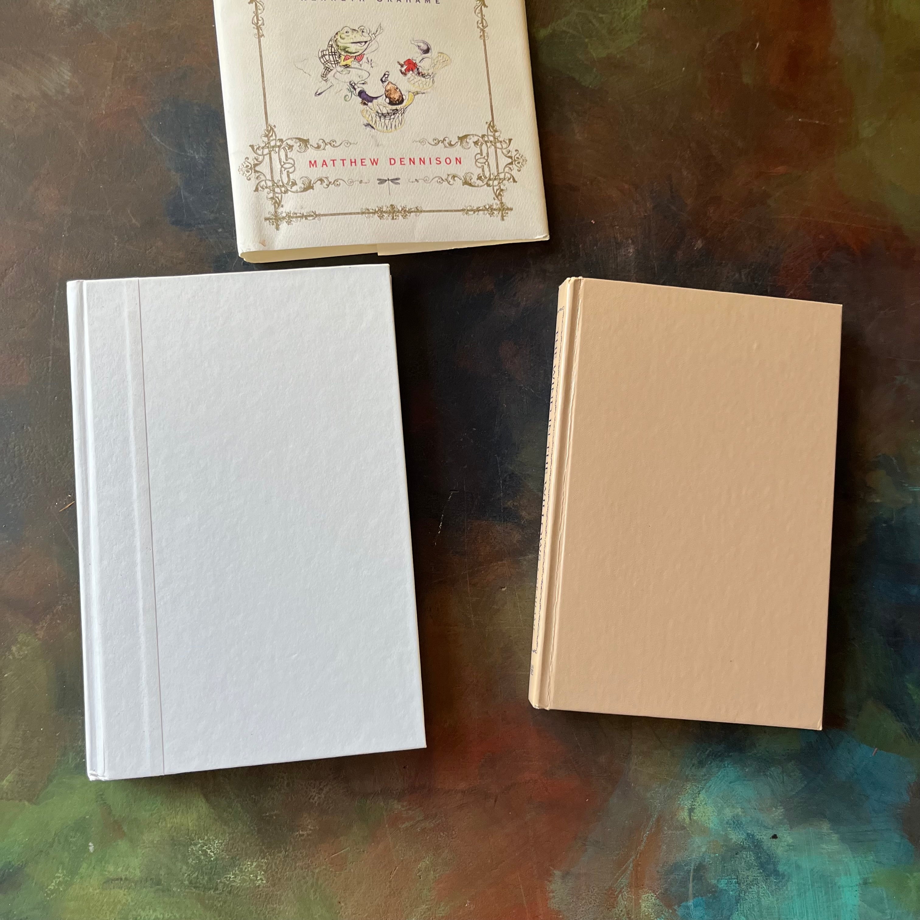 Pair of Kenneth Grahame Books: The Man in the Willows: The Life of Kenneth Grahame and The Wind in the Willows written by Kenneth Grahame & Illustrated by Tasha Tudor-view of the front covers