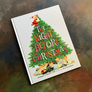 The Night Before Christmas-Clement C. Moore-Gyo Fujikawa illustrations-vintage picture book-Christmas Read Aloud-view of the front cover with a christmas tree with Santa putting a start on the stop and children and pets sleeping under the tree