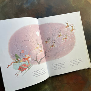 The Night Before Christmas-Clement C. Moore-Gyo Fujikawa illustrations-vintage picture book-Christmas Read Aloud-view of the illustration of santa and his sleigh and reindeer flying through the trees