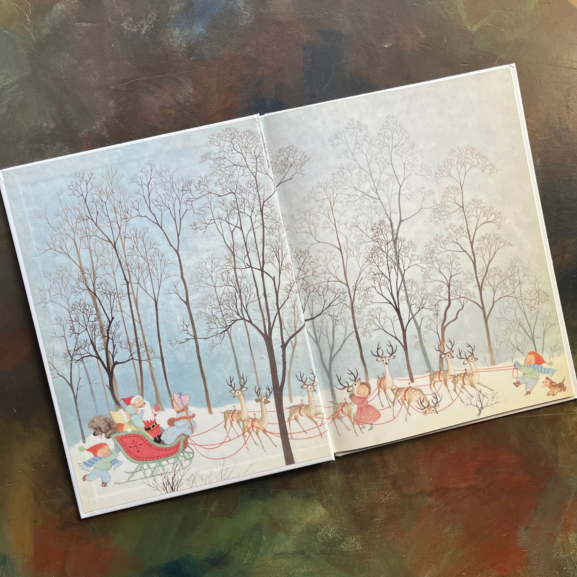 The Night Before Christmas-Clement C. Moore-Gyo Fujikawa illustrations-vintage picture book-Christmas Read Aloud-view of the inside cover with santa in his sleigh with all this reindeer and a few children and pets