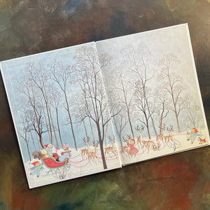 The Night Before Christmas-Clement C. Moore-Gyo Fujikawa illustrations-vintage picture book-Christmas Read Aloud-view of the inside cover with santa in his sleigh with all this reindeer and a few children and pets
