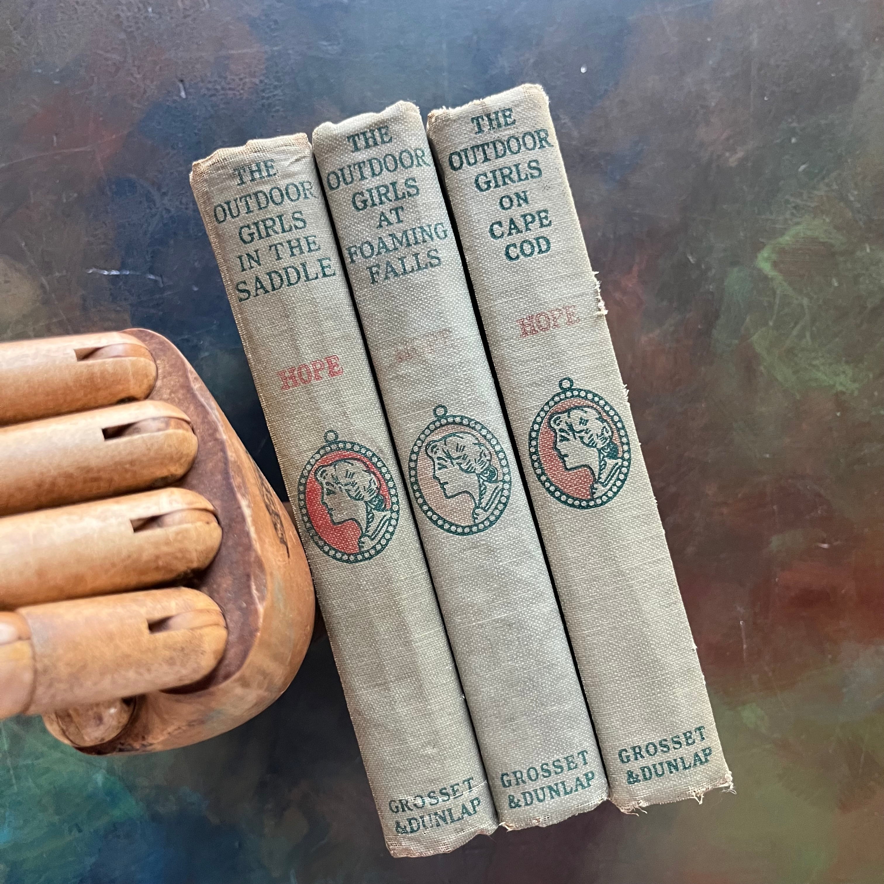 The Outdoor Girls on Cape Cod-The Outdoor Girls at Foaming Falls-The Outdoor Girls in the Saddle-Laura Lee Hope-vintage adventure books for girls-view of the spines