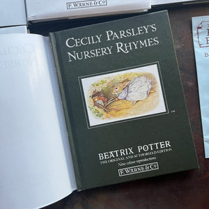  The Peter Rabbit Library Complete 23 Volume Set Written & Illustrated by Beatrix Potter-classic children's stories-children's bookshelf must have-view of the clothbound front cover in green 