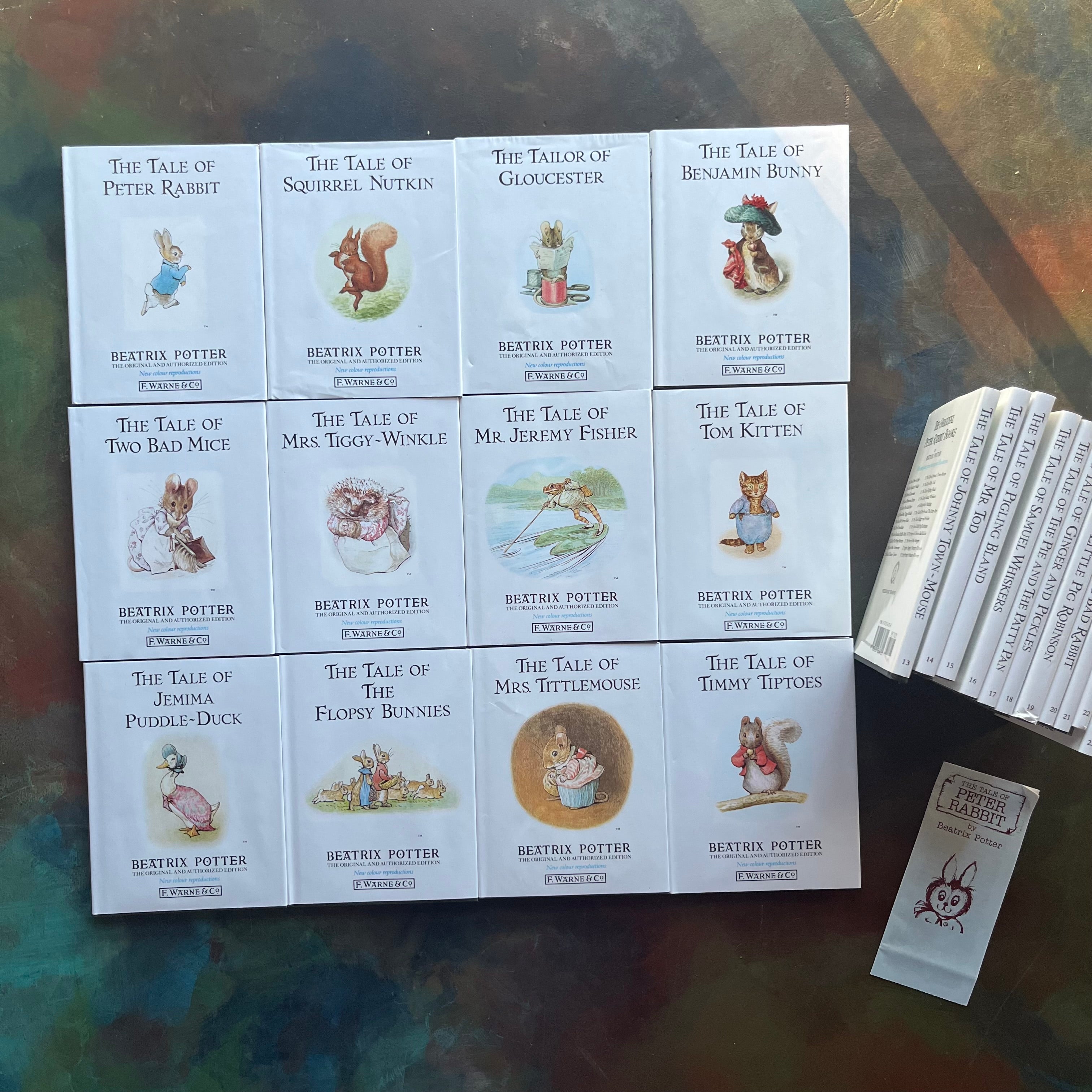  The Peter Rabbit Library Complete 23 Volume Set Written & Illustrated by Beatrix Potter-classic children's stories-children's bookshelf must have-view of the front covers of the first 12 volumes