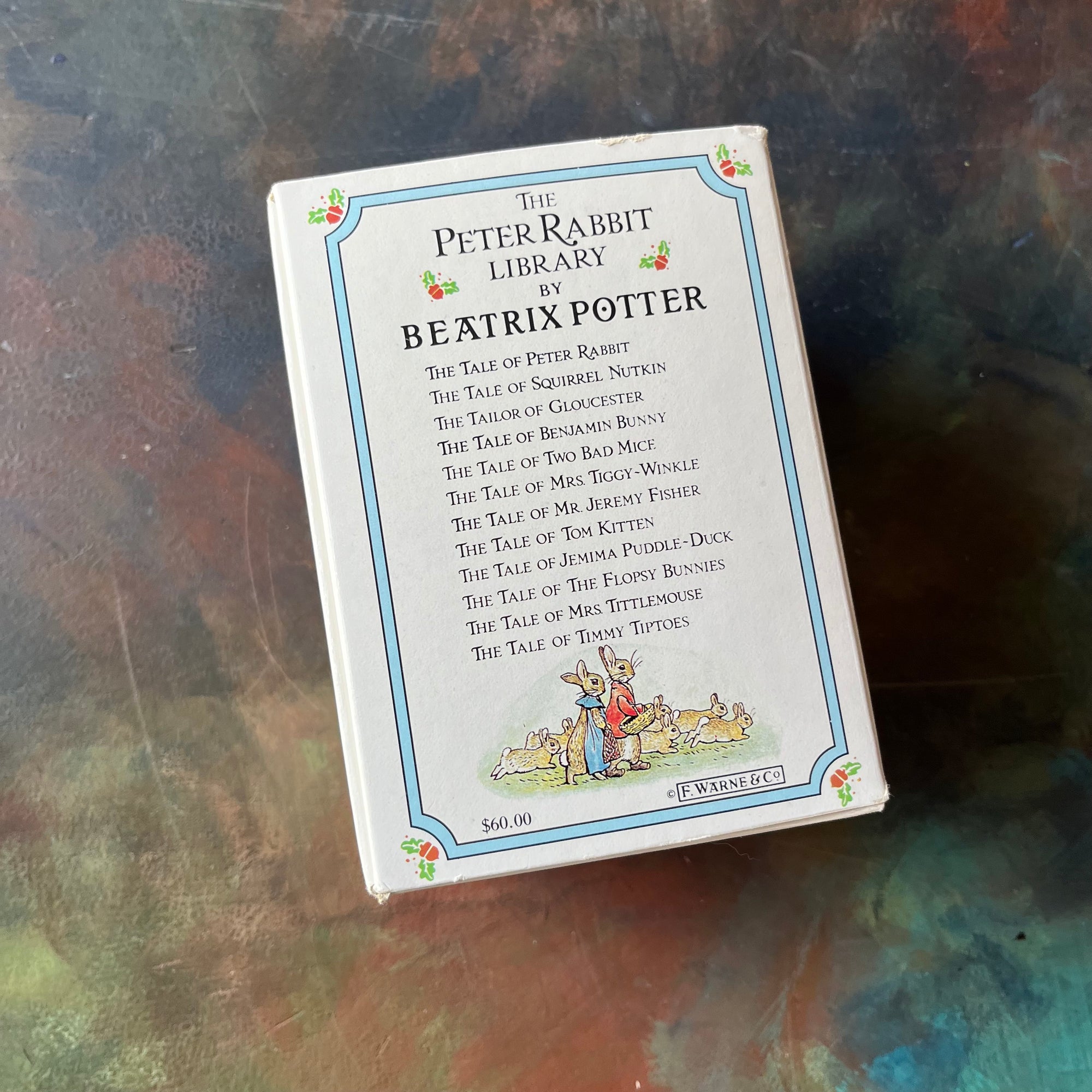 The Peter Rabbit Library by Beatrix Potter-Books 1 through 12-vintage children's storybooks-children's animal stories-view of the back of the book sleeve with a list of the books included in this set