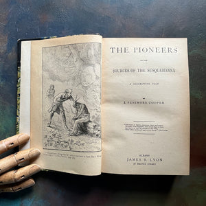 The Pioneers written by James Fenimore Cooper-book one of the leather stocking tales-antique leather-bound book with marbled cover-vintage adventure book-view of the title page & frontispiece