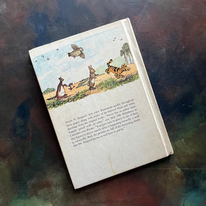 The Pooh Story Book written by A.A. Milne with black and white and color illustrations by E.H. Shepard-classic picture book-read aloud favorite-a log cabin 100 book-view of the back cover with tiger, rabbit, kanga, roo and owl walking in the line as well