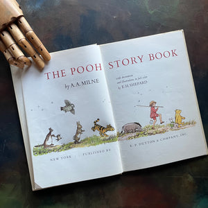The Pooh Story Book written by A.A. Milne with black and white and color illustrations by E.H. Shepard-classic picture book-read aloud favorite-a log cabin 100 book-view of the title page