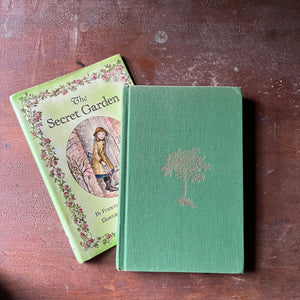vintage children's chapter books, Tasha Tudor Illustrations, classic literature, read aloud book - The Secret Garden written by Frances Hodgson Burnett with illustrations by Tasha Tudor - view of the front cover with an embossed tree in the middle
