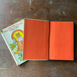 vintage children's chapter book, Junior Deluxe Editions Book - The Story of Doctor Dolittle written by Hugh Lofting with illustrations by Murray Tinkelman - view of the inside cover in plain orage