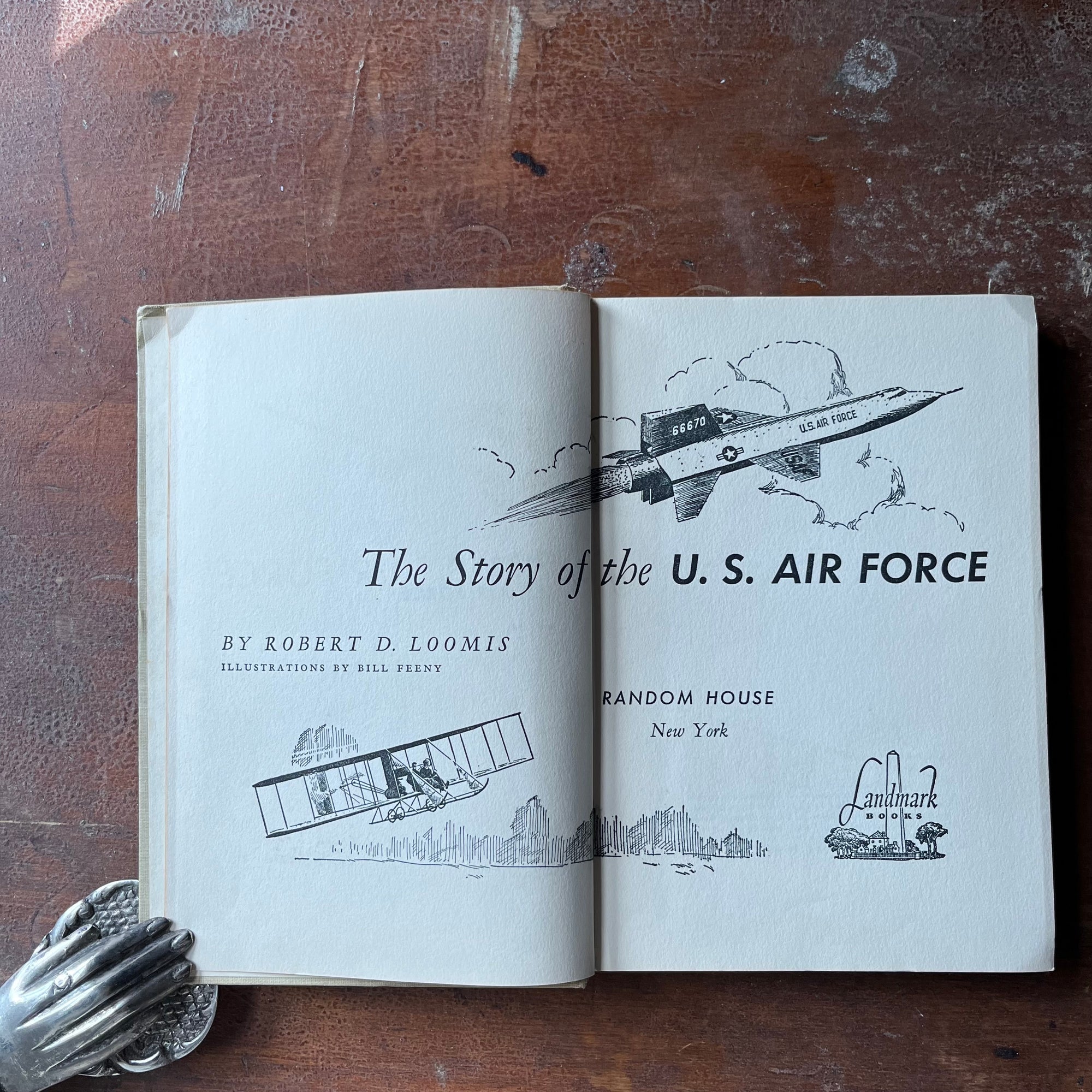 vintage children's living history book - The Story of the U. S. Air Force is a 1959 Landmark Series Book written by Robert D. Loomis with illustrations by Bill Feeny - view of the title page showing different illustrations of planes through the years