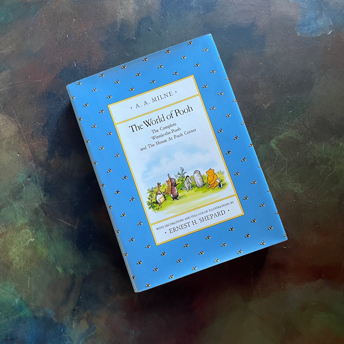 The World of Pooh-The Complete Winnie the Pooh and The House at Pooh Corner-A. A. Milne-E. H. Shepard-Read Aloud Revival-vintage children's short stories-view of the dust jacket's front cover with an illustration of the animal characters from Winnie the Pooh