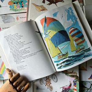 Open book with colorful illustrations of sailboats from inside these editions. The Young Children's Encyclopedia Complete 16 Volume Set-Encyclopedia Britannica-1970's living kids books-living books-view of the inside content