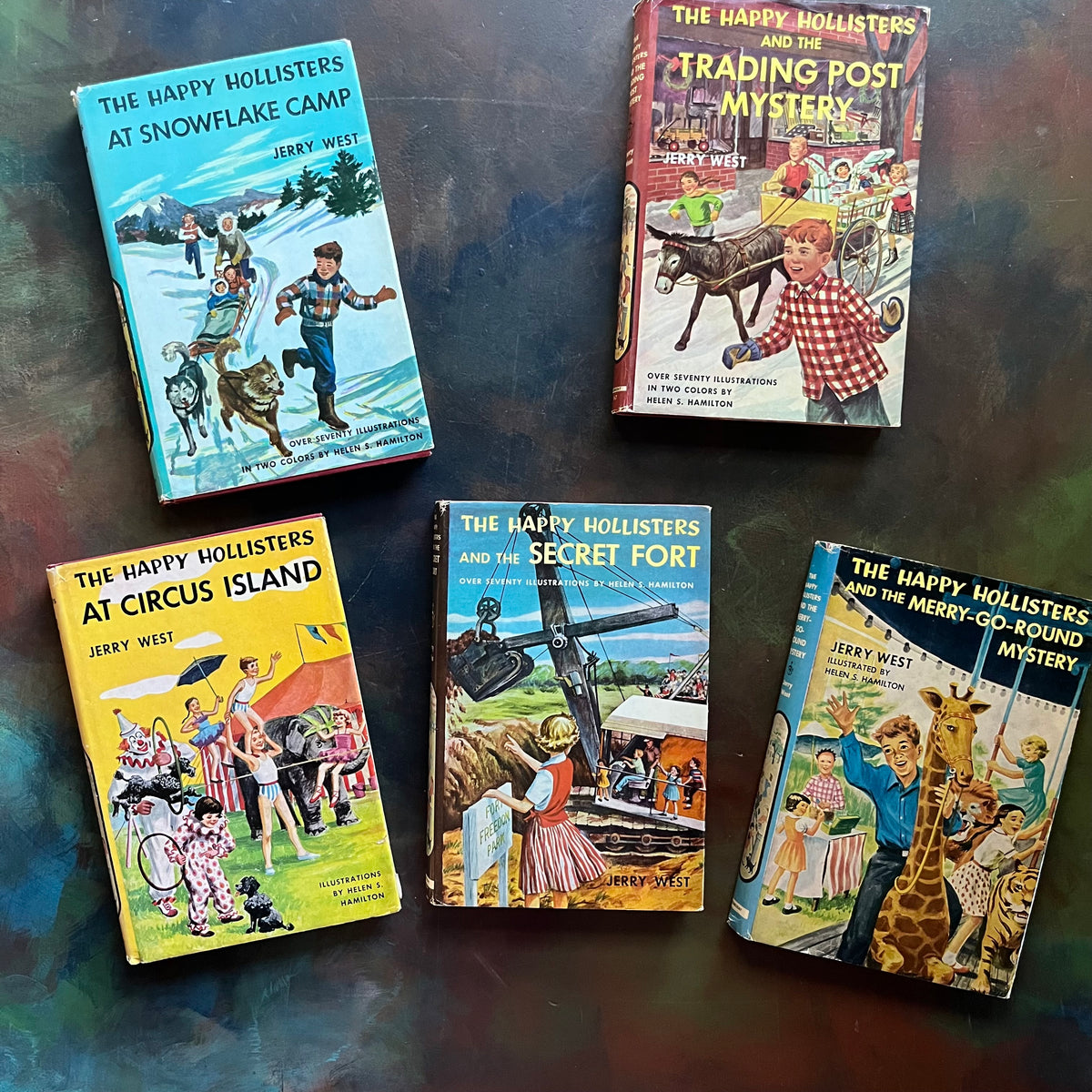 The Happy Hollisters Mystery Series by Jerry West-Starter Set Books 1-5-vintage children's mystery books-wholesome family reads-view of the dust jacket's front covers with scenes from each book on the cover in bright colors