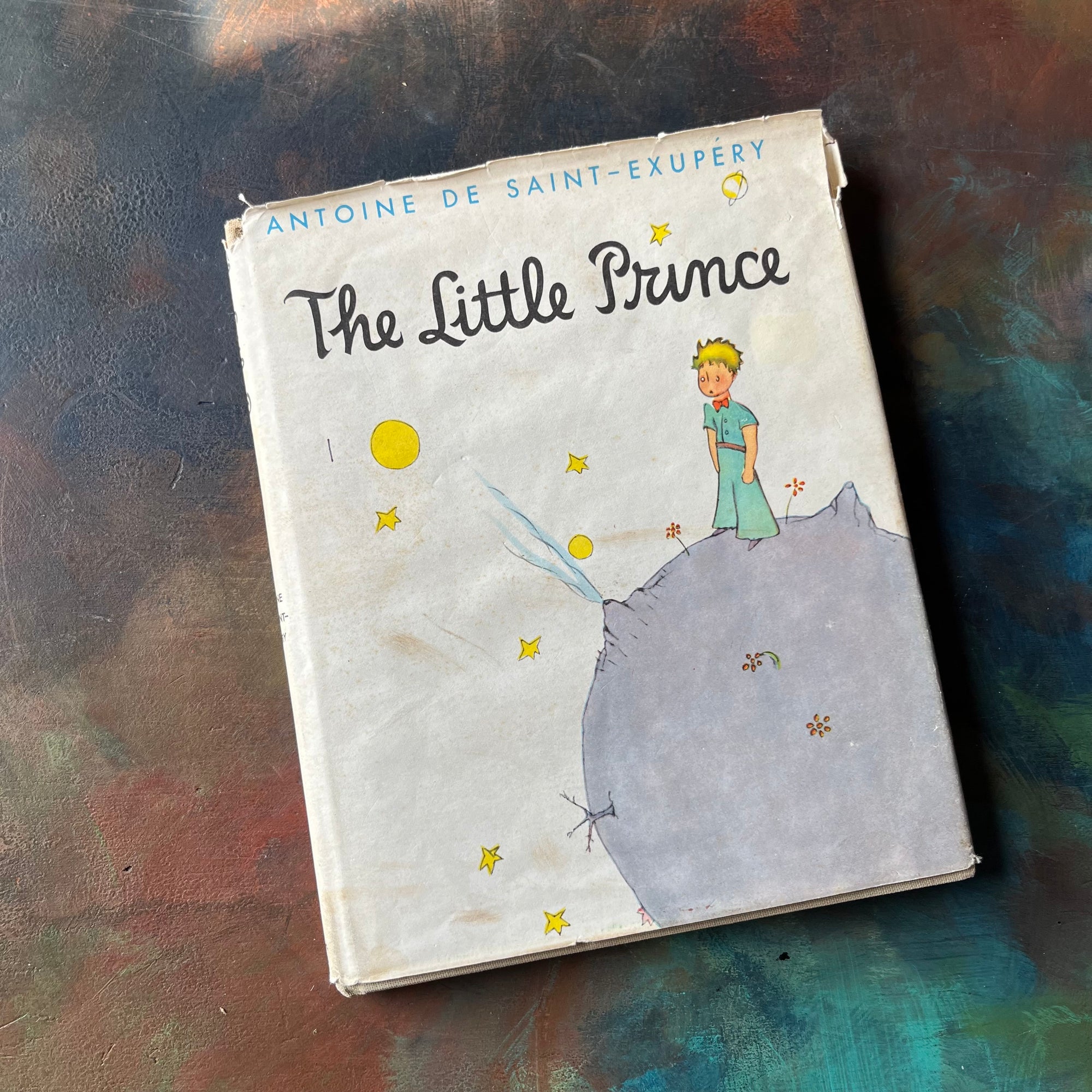 The Little Prince written & illustrated by Antoine De Saint-Exupery-vintage children's classic literature-vintage children's chapter book-view of the dust jacket's front cover