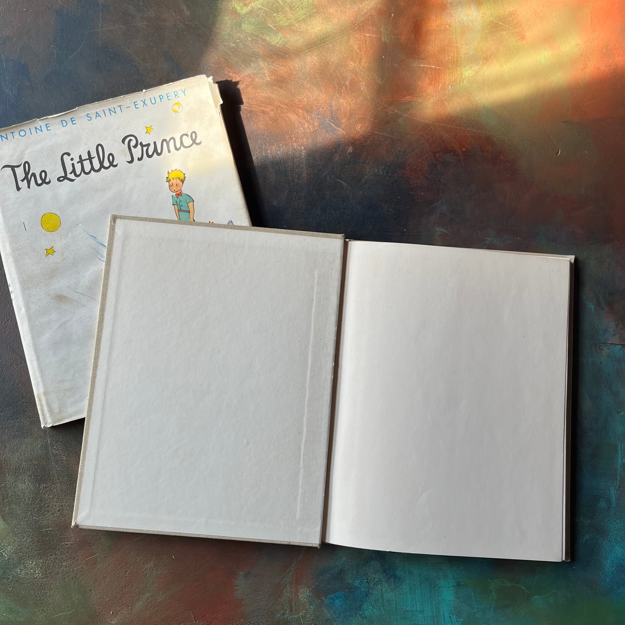 The Little Prince written & illustrated by Antoine De Saint-Exupery-vintage children's classic literature-vintage children's chapter book-view of the inside cover