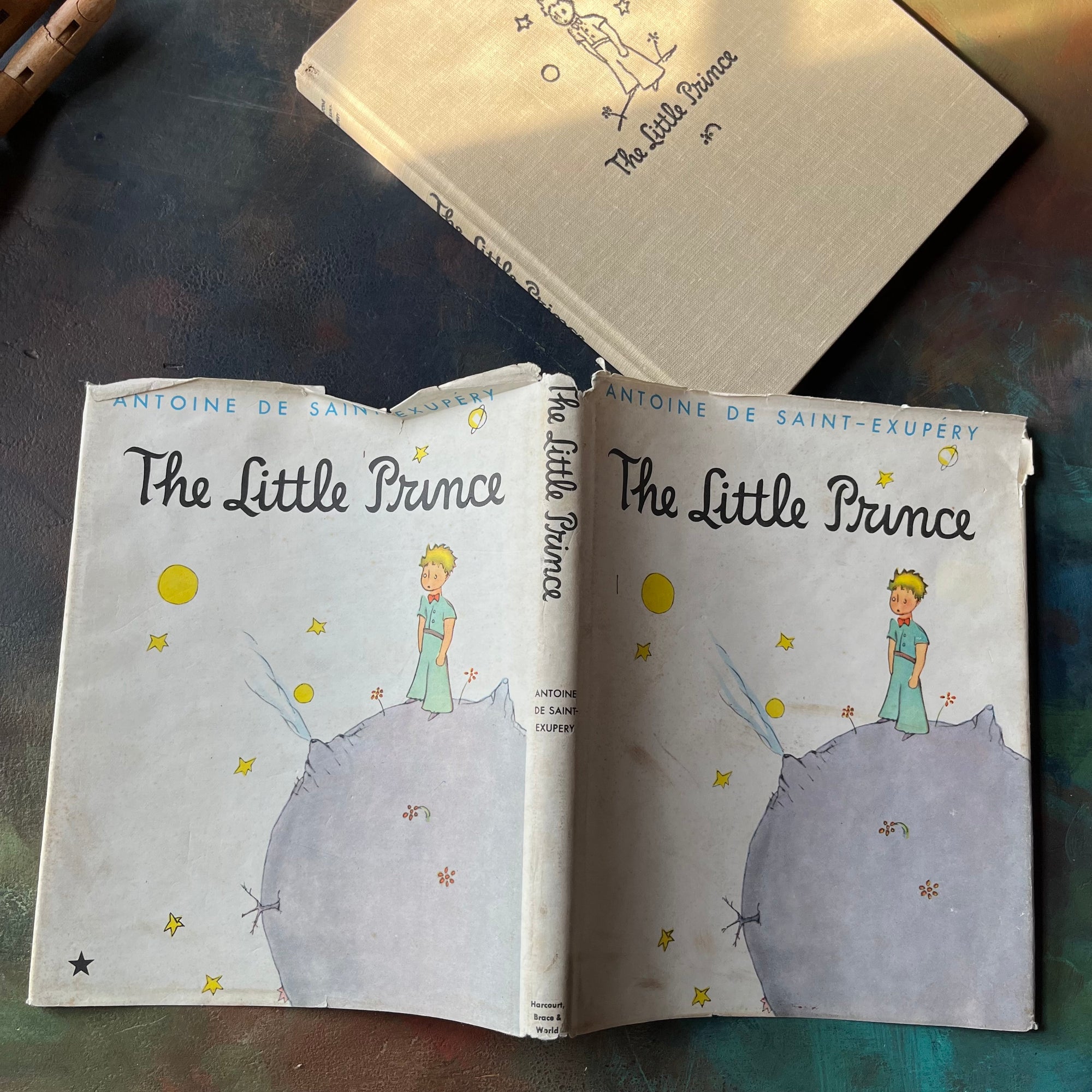 The Little Prince written & illustrated by Antoine De Saint-Exupery-vintage children's classic literature-vintage children's chapter book-view of the outside of the dust jacket