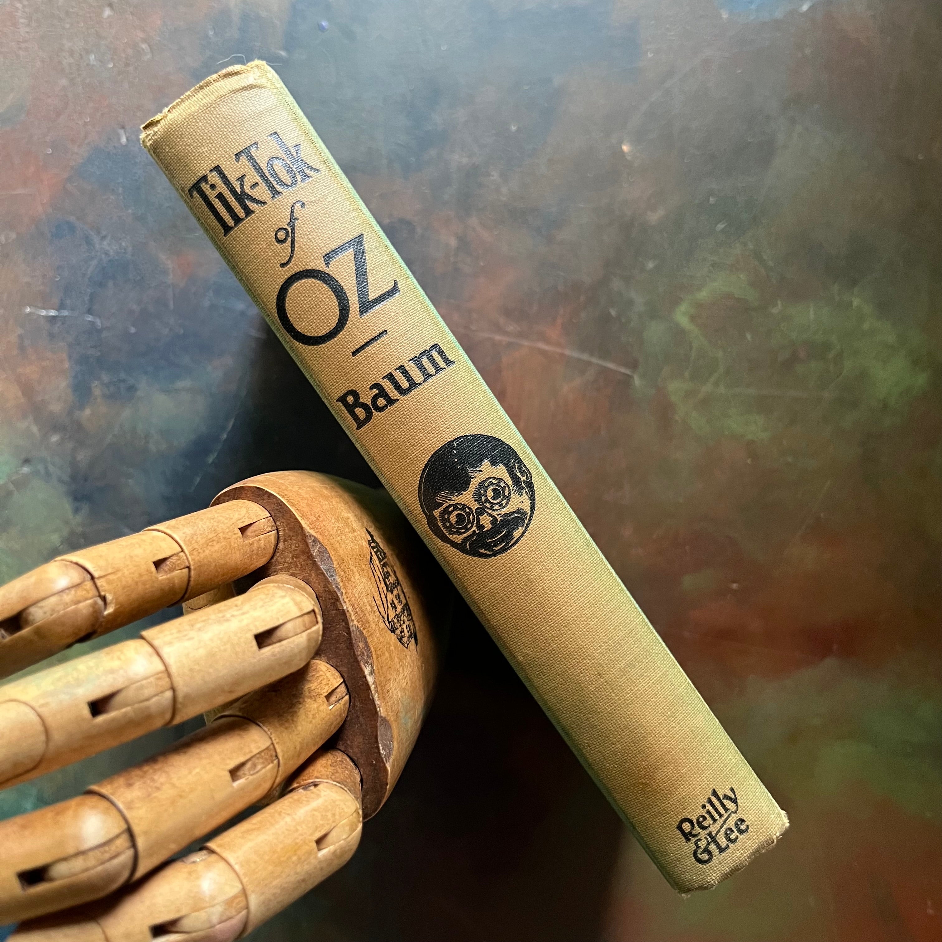 Tik-Tok of Oz written by L. Frank Baum with illustrations by John R. Neill-1914 Edition-modern day fairy tale-classic children's literature-vintage children's chapter book-view of the spine