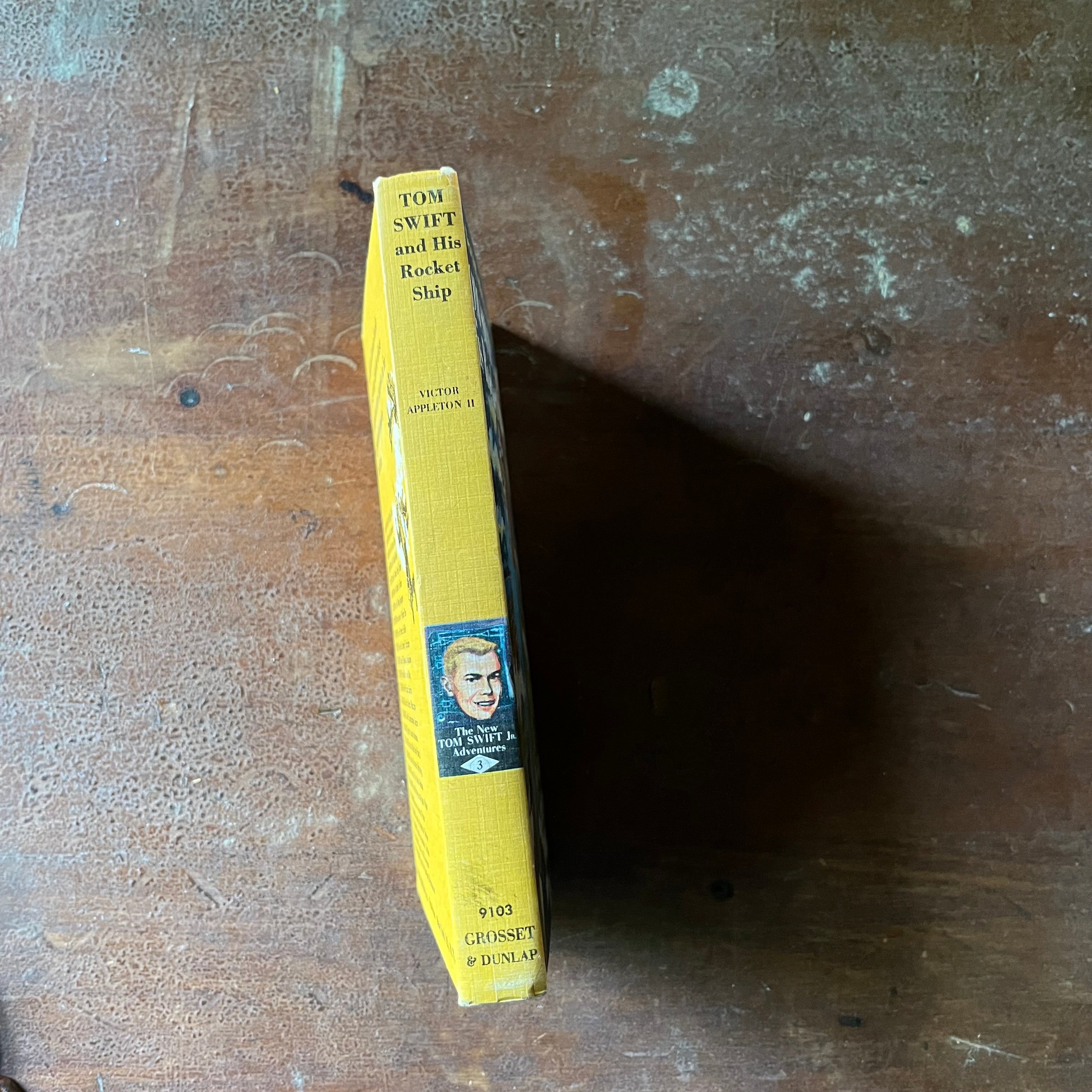 vintage children's adventure chapter books for boys, The New Tom Swift Jr. Adventure Series Book - Tom Swift and His Rocket Ship written by Victor Appleton II with illustrations by Graham Kaye - view of the spine