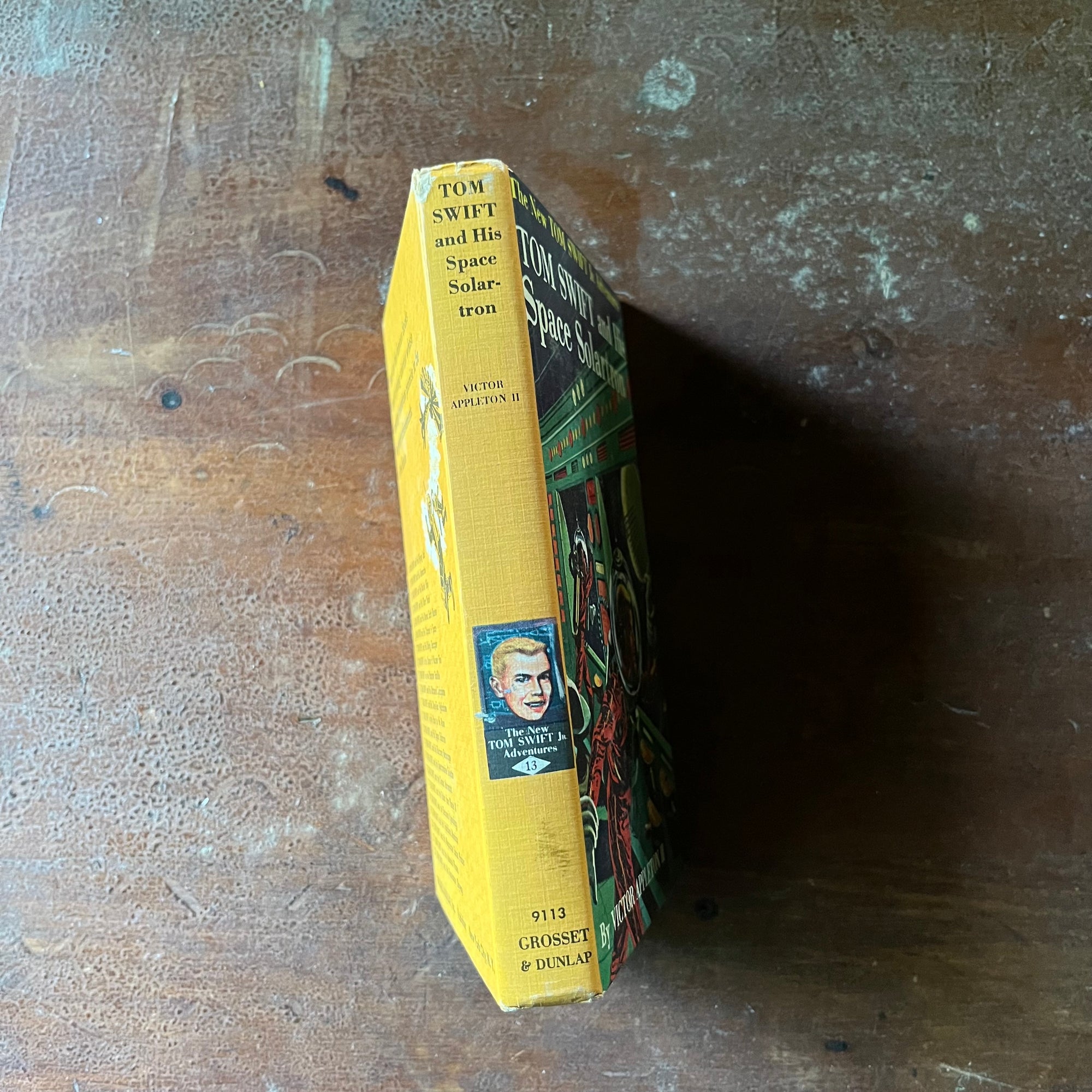 vintage children's chapter book, vintage adventure book, The New Tom Swift Jr. Adventures Book - Tom Swift & This Space Solartron written by Victor Appleton II with illustrations by Graham Kaye - view of the spine