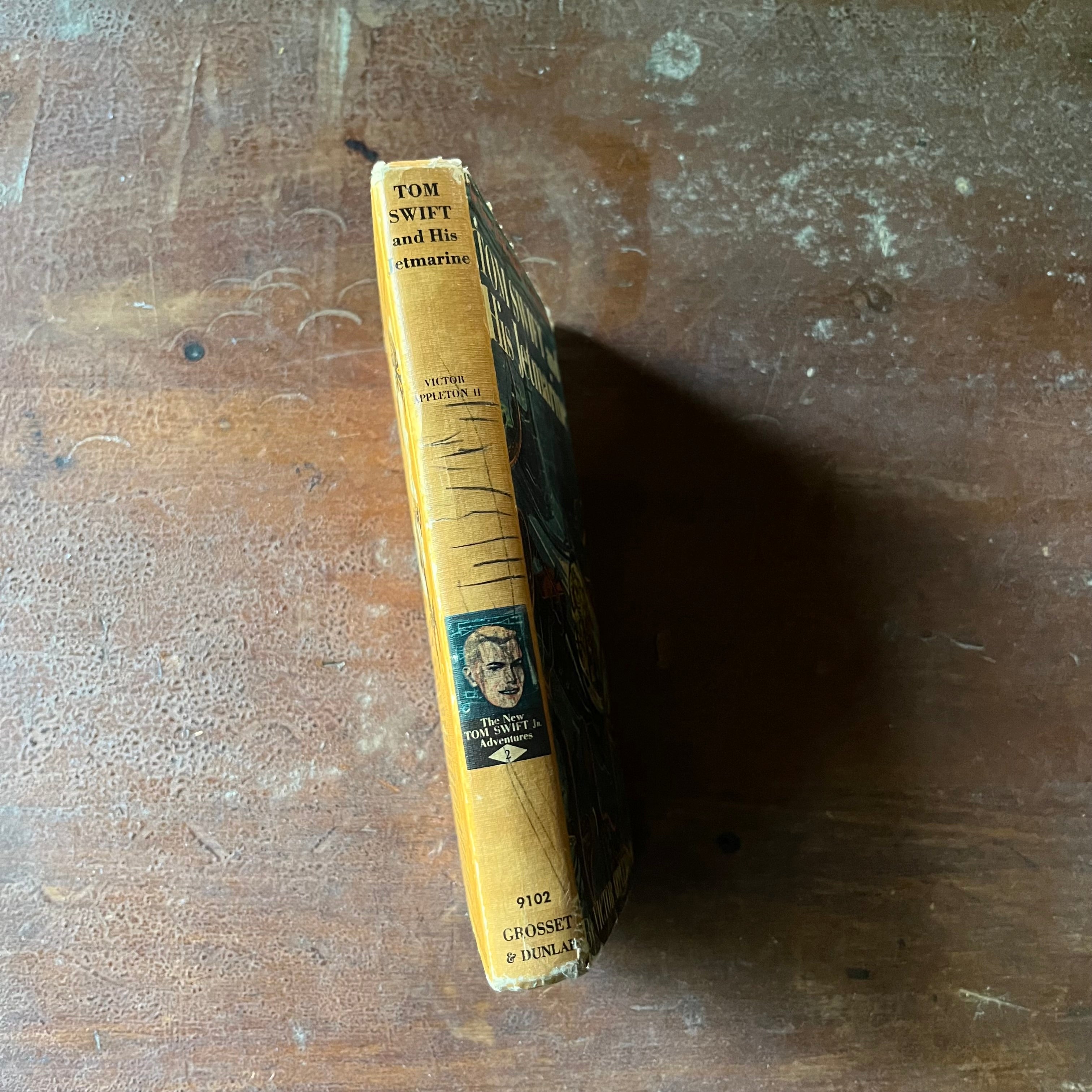 vintage children's chapter book, vintage children's adventure book, The New Tom Swift Jr. Adventure Book - Tom Swift and His Jetmarine written by Victor Appleton II with illustrations by Graham Kaye - view of the spine