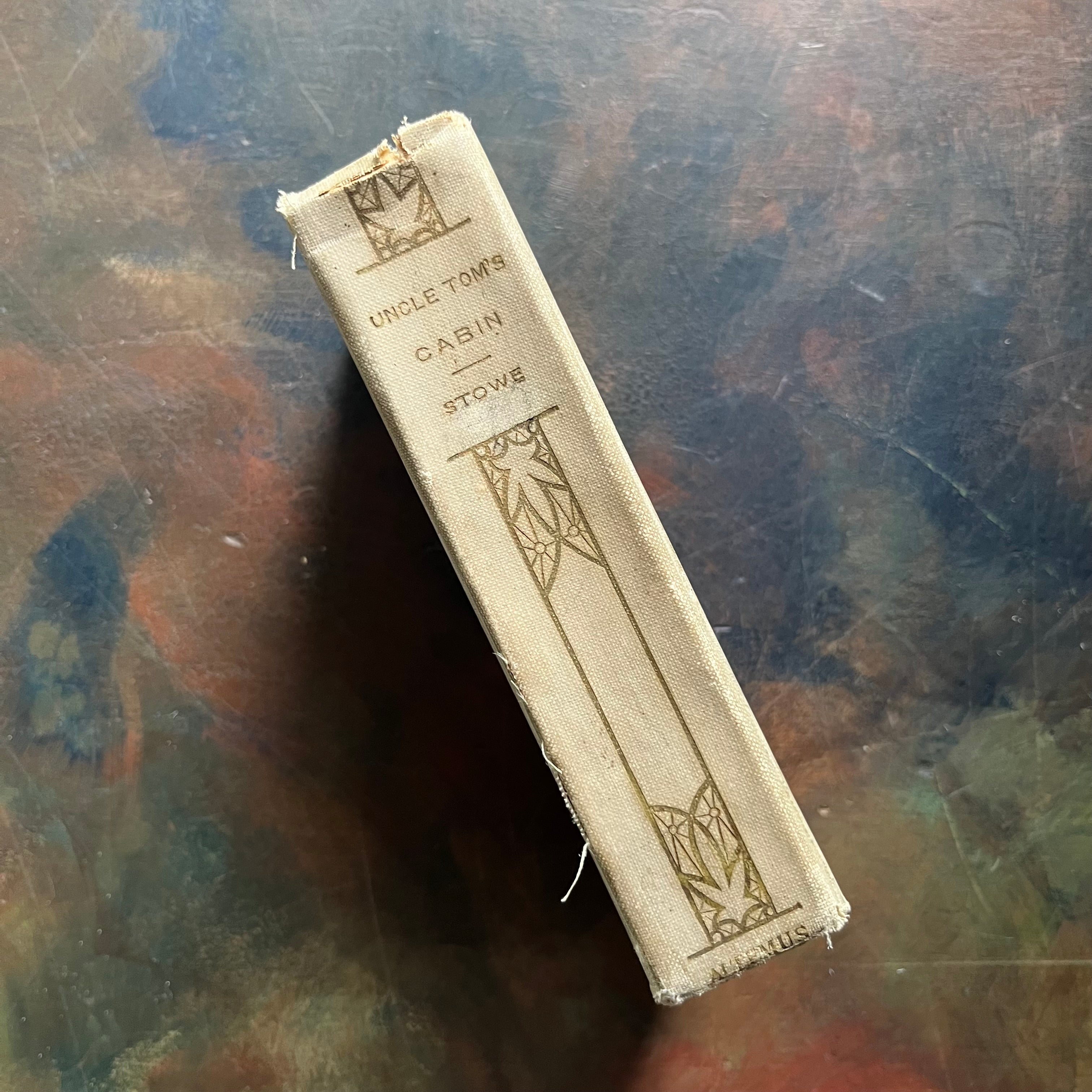 Uncle Tom’s Cabin written by Harriet Beecher Stowe-1907 Henry Altemus Petit Trianon Edition-classic American Literature-view of the spine with a design style common on the Altemus spines of that era