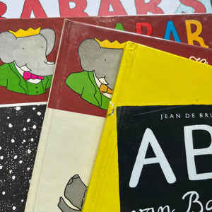 Vintage Babar Books-Four-Book French & Paris Collection by Jean de Brunhoff-Babar's Guide to Paris by Laurent De Brunhoff-Jean De Brunhoff ABC Van Babar (Dutch book)-Histoire de Babar-Babar et le Pere Noel-vintage picture books-foreign languages-view of the closeup of the covers including minor damage noted on ABC van Babar