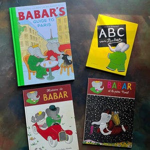 Vintage Babar Books-Four-Book French & Paris Collection by Jean de Brunhoff-Babar's Guide to Paris by Laurent De Brunhoff-Jean De Brunhoff ABC Van Babar (Dutch book)-Histoire de Babar-Babar et le Pere Noel-vintage picture books-foreign languages-view of the front covers - all depicting images of Babar