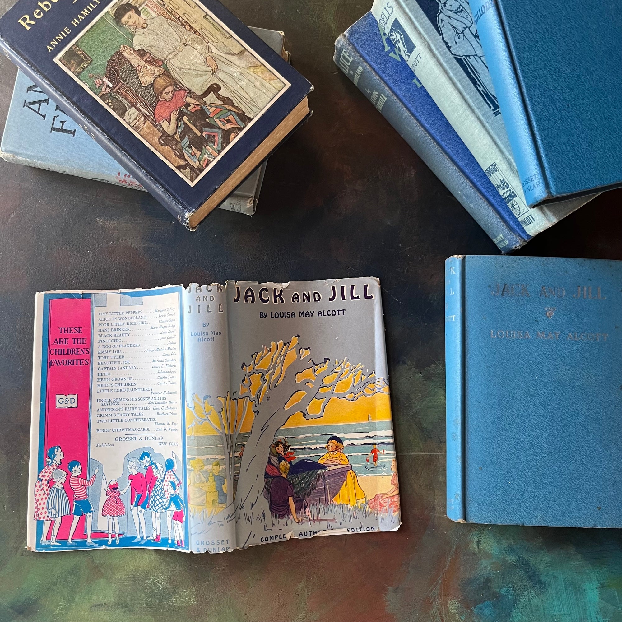 Vintage Blue Book Stack-classic children's literature-Alice in Wonderland-Pinocchio-Jack & Jill-Fidelis-Ann's Family-view of the spines-view of the dust jacket for Jack & Jill