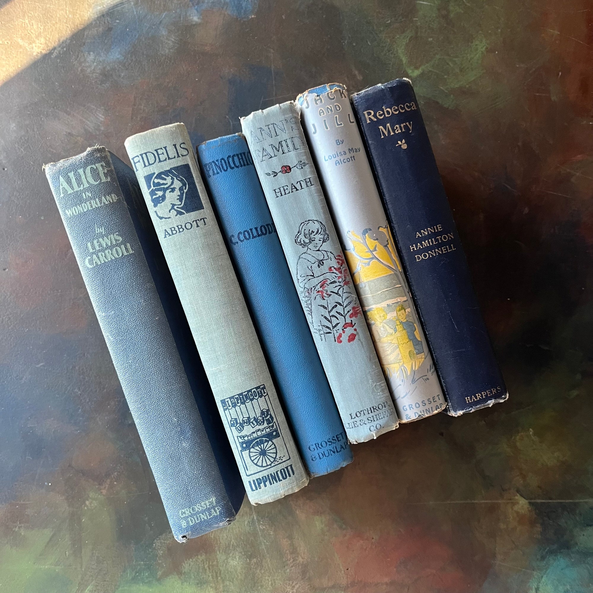 Vintage Blue Book Stack-classic children's literature-Alice in Wonderland-Pinocchio-Jack & Jill-Fidelis-Ann's Family-view of the spines-view of the spines with the dust jacket