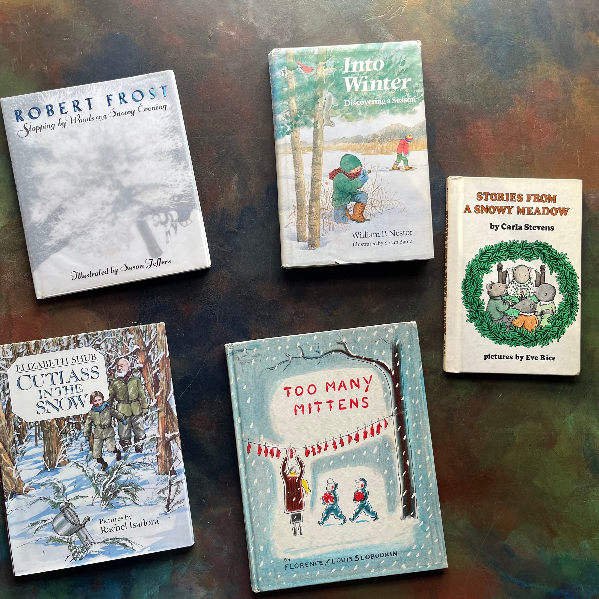 Vintage Children's Winter Themed Picture Books-Stories From A Snowy Meadow-Too Many Mittens, Cutlass in the Snow, Into Winter, Stopping by Woods in a Snowy Evening by Robert Frost-view of the front covers