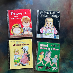 Set of four Vintage Little Golden Books children's picture books illustrated by Eloise Wilkin - Prayers for Children, We Like Kindergarten, Mother Goose and Hi Ho! Three in a Row - view of the front covers with illustrations of children by Eloise Wilkin 