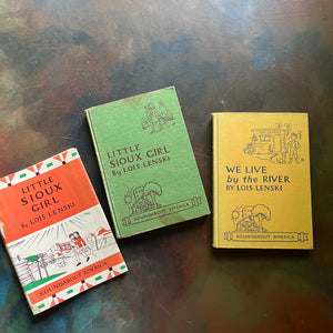 Vintage Lois Lenski Roundabout America Series Books-written and illustrated by Lois Lenski-We Live by the River-Little Sioux Girl-America250-1950s children's literature-living books-living history books-view of the front covers