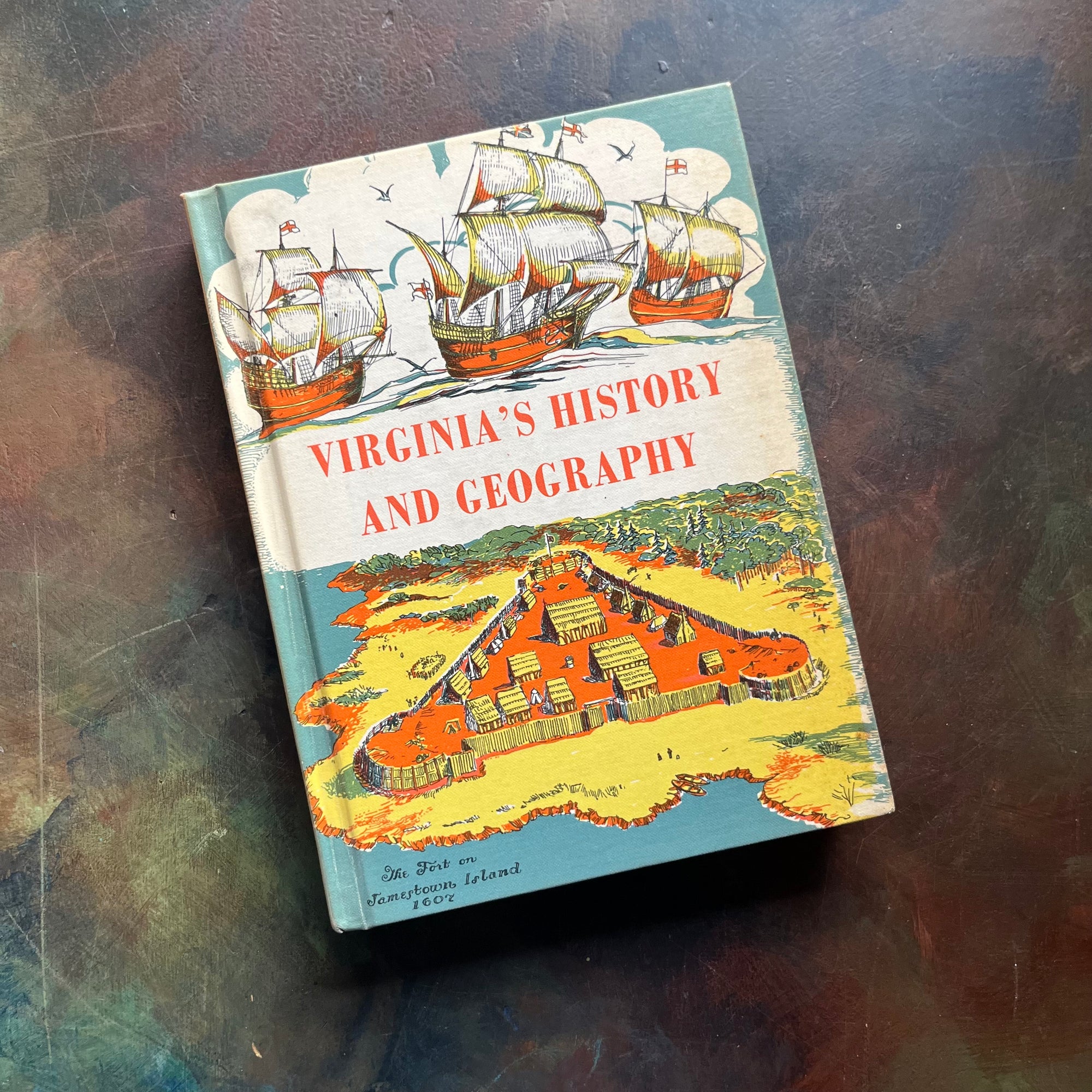 Virginia's History & Geography-Our Home Virginia & The World-vintage US History textbooks-America250-view of the front cover with ships and Jamestown Island depicted.