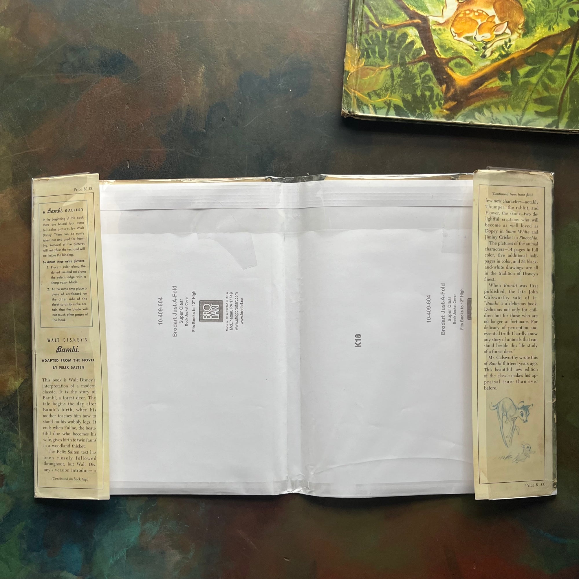 Walt Disney's Bambi- 1941 First Edition-vintage children's picture book-classic children's literature-view of the dust jacket's inside flaps wrapped in a plastic sleeve - note they are intact & have not been clipped